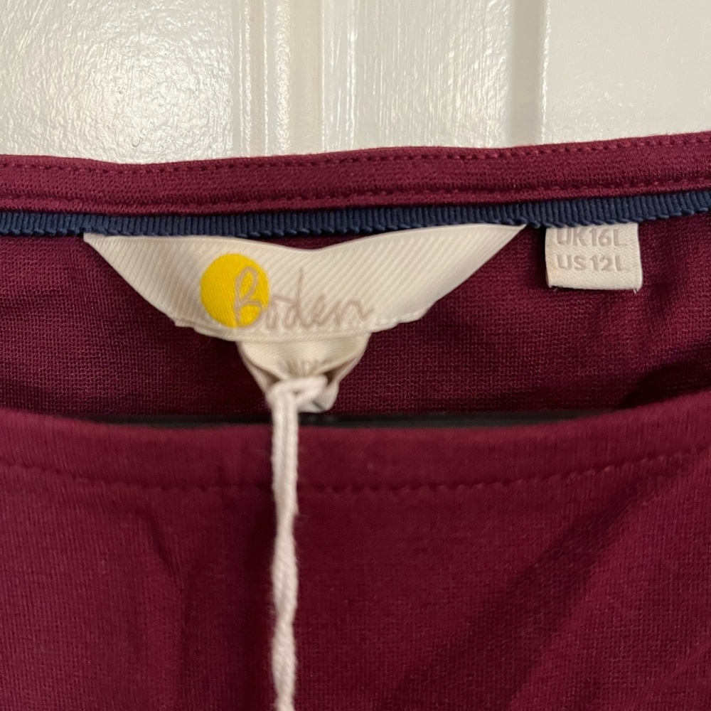 Burgundy, long sleeve dress by Biden. Size 12. New with tags.